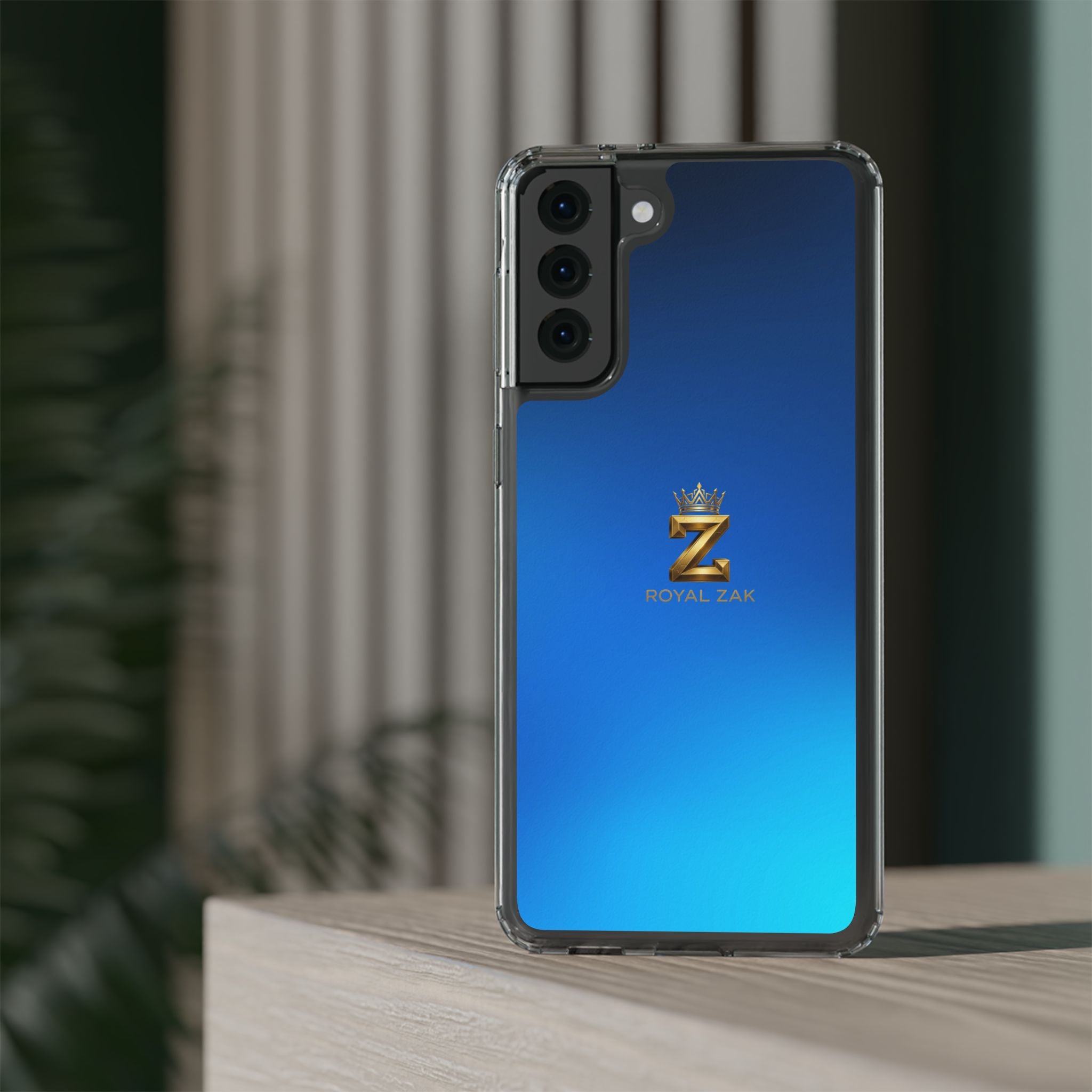 Clear Impact-Resistant Phone Case — Blue Gradient with Gold “Royal Zak” Crown Logo