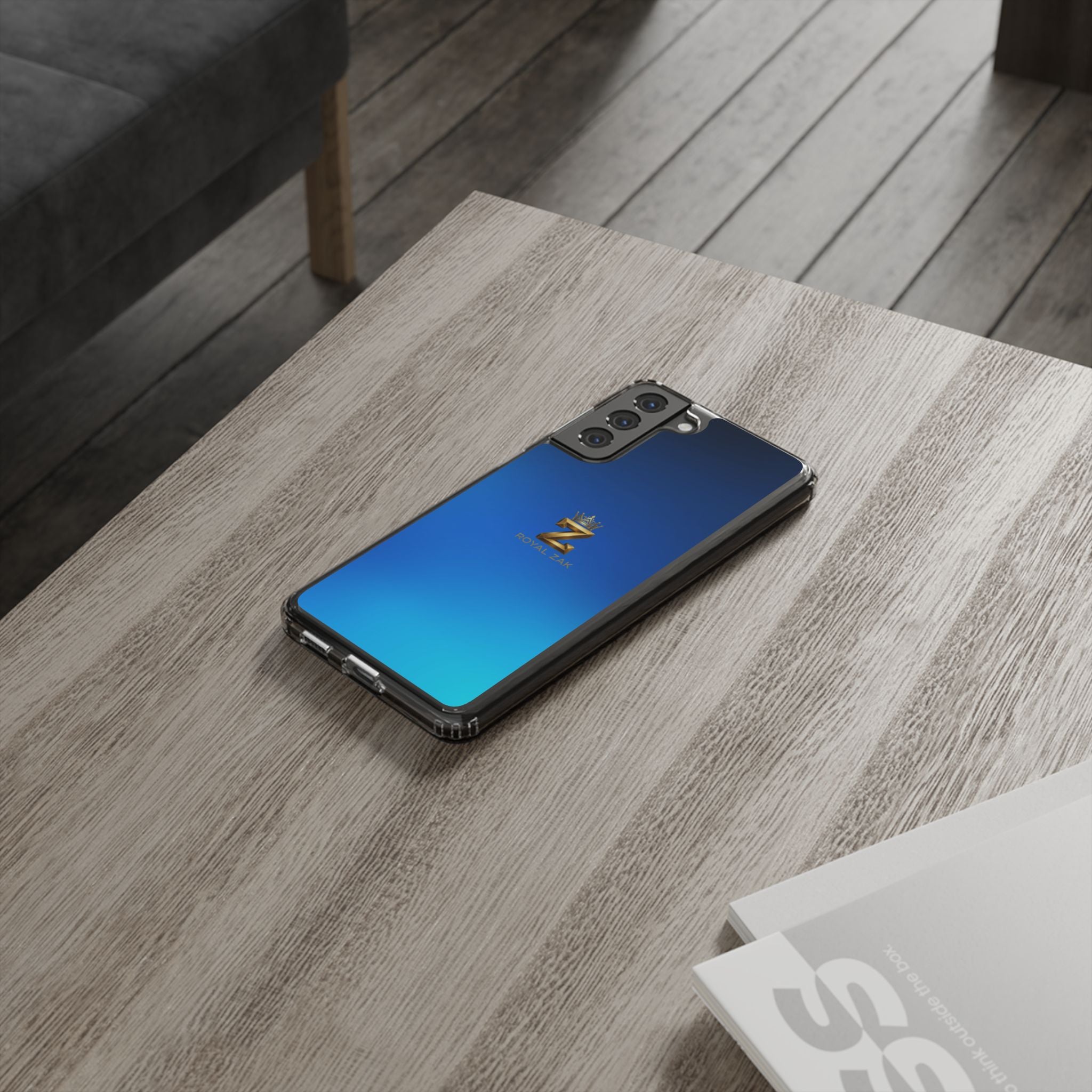 Clear Impact-Resistant Phone Case — Blue Gradient with Gold “Royal Zak” Crown Logo