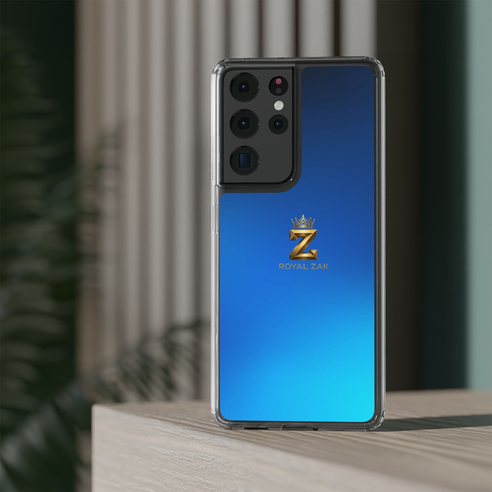 Clear Impact-Resistant Phone Case — Blue Gradient with Gold “Royal Zak” Crown Logo