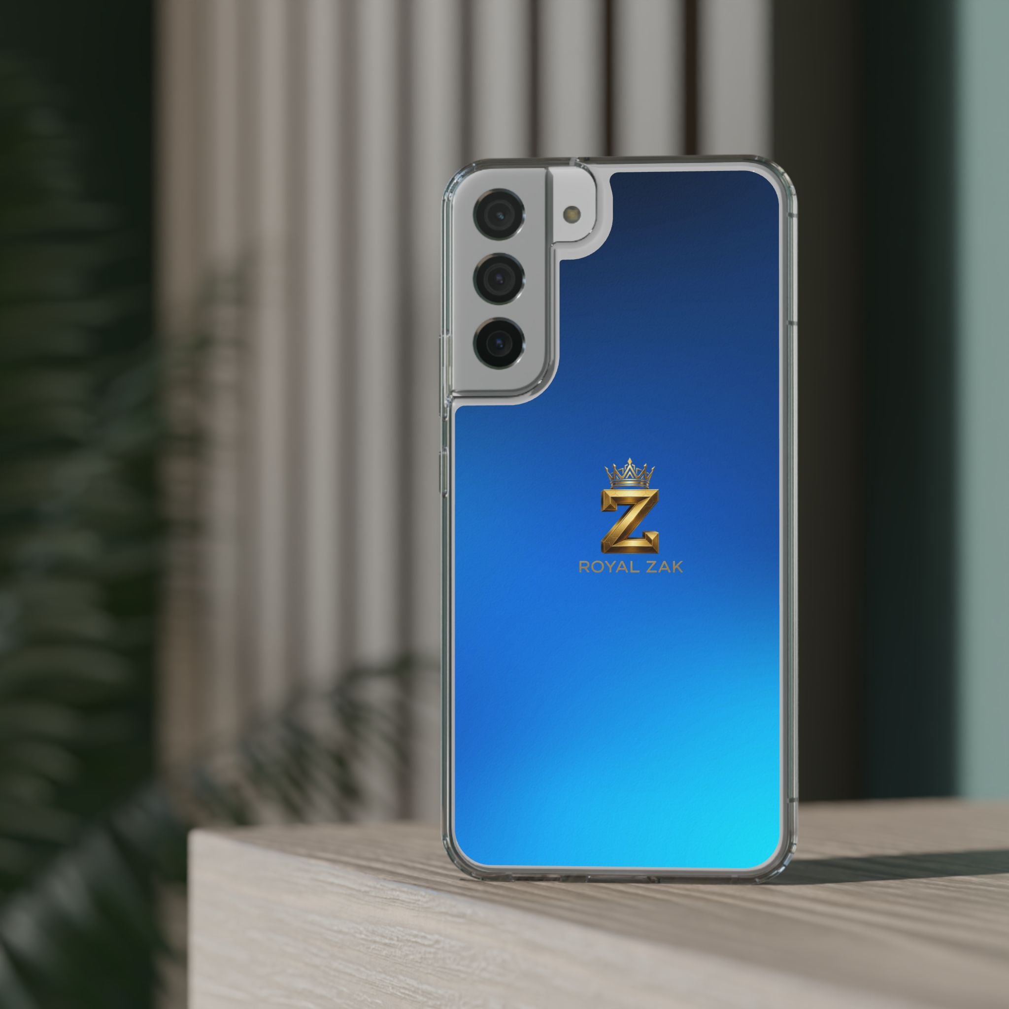 Clear Impact-Resistant Phone Case — Blue Gradient with Gold “Royal Zak” Crown Logo